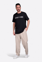 Model wearing EV black t-shirt by East Vibe